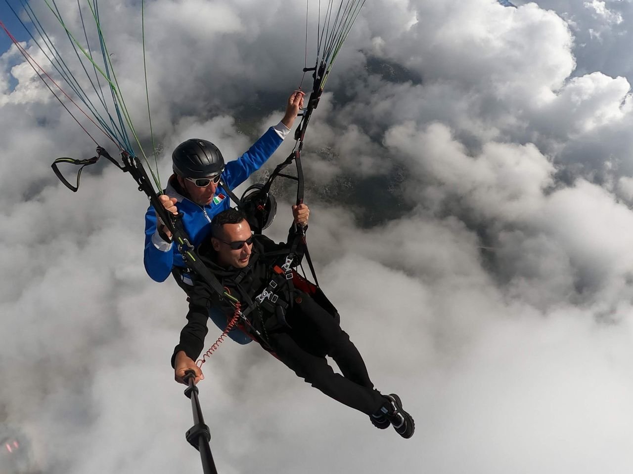 Crafting Captivating Headlines: Your awesome post title goes here Thrilling tandem paragliding experience soaring through the sky above the clouds.